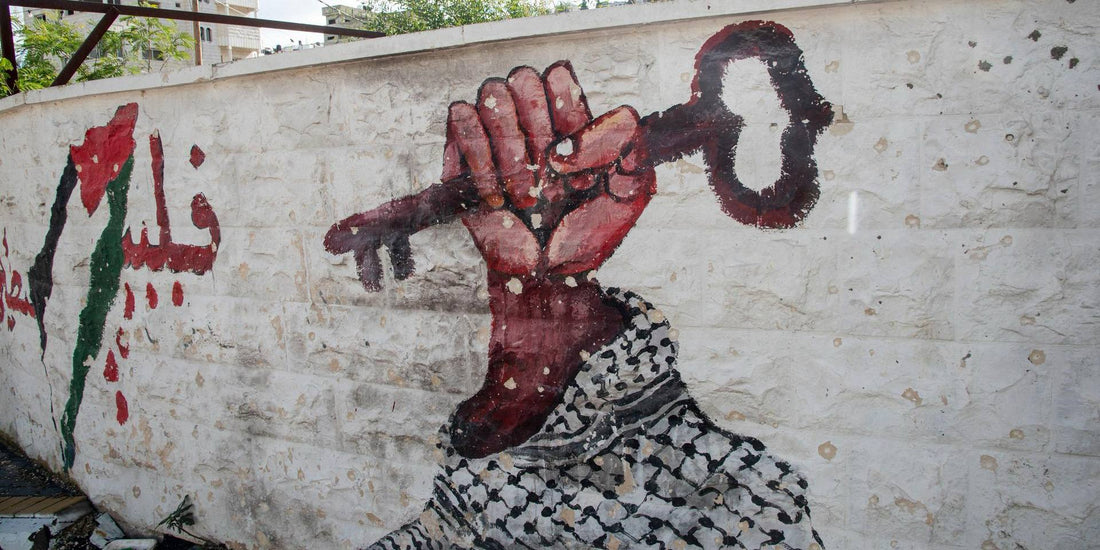 Graffiti an der Grenzmauer in Palästina. Kufiya mit Schlüssel. Symbole Palästinas